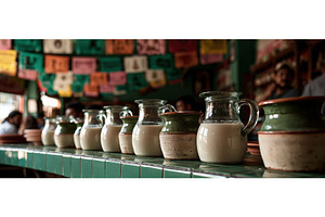 Traditional Pulque Jugs Lined Up in, a Food & Drink Photo by piter.goskov