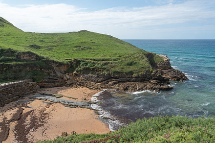Picturesque view of rocky cliff on seashore, a Holiday Photo by Iván Moreno STOCK PHOTO
