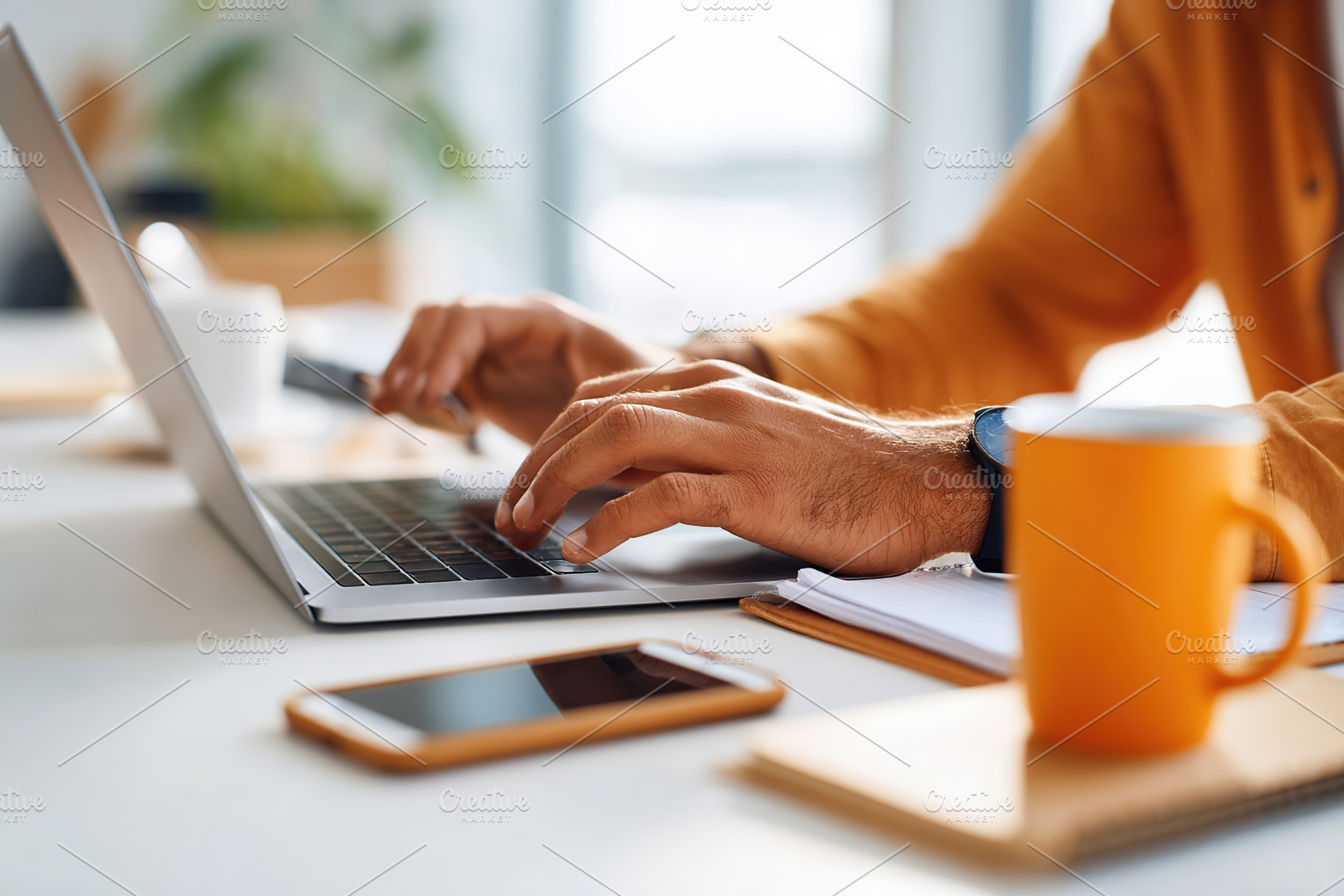 Hands typing on a sleek laptop in a cozy workspace during a productive afternoo, a Business Photo by AlyaAnd