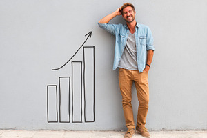 Man beside drawn bar graph representing growth, a Business Photo by AlyaAnd