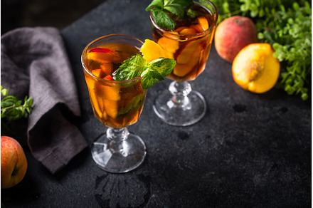 Cold ice tea with peach and mint, a Food & Drink Photo by Yulia Furman