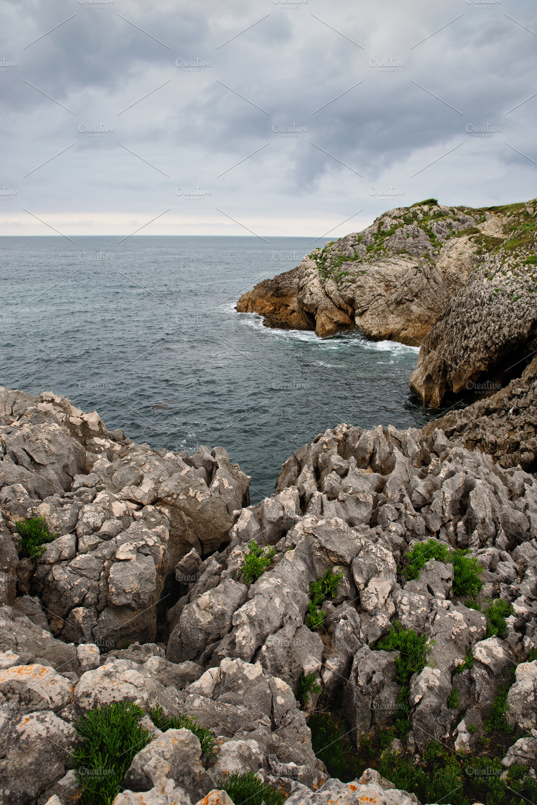 Rocky cliffs above the ocean with op, a Nature Photo by Perpis