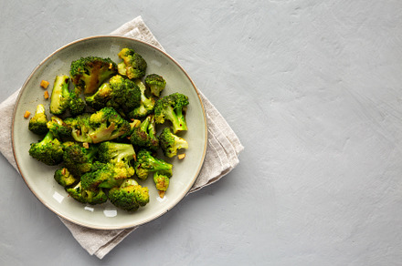 Homemade Pan-Fried Broccoli on a Plate, top view. Flat lay, over, a Food & Drink Photo by LiudmylaChuhunova