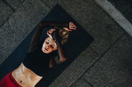 Fitness woman doing workout lying stock photo containing active and activity, a Sports & Recreation Photo by Jacob Lund