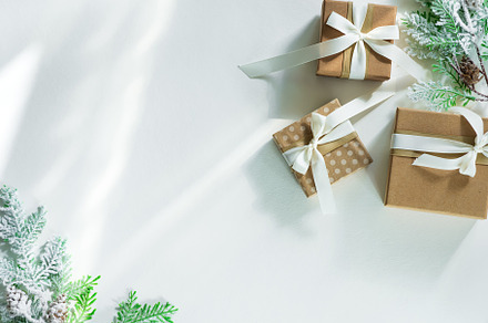 Gift boxes with snow fir branches containing xmas, card, and background, a Holiday Photo by YuMyart