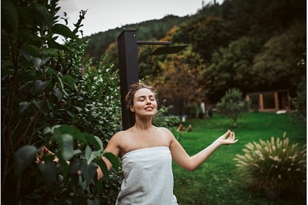 Beautiful woman meditating outdoor, a Beauty & Fashion Photo by HalfPoint