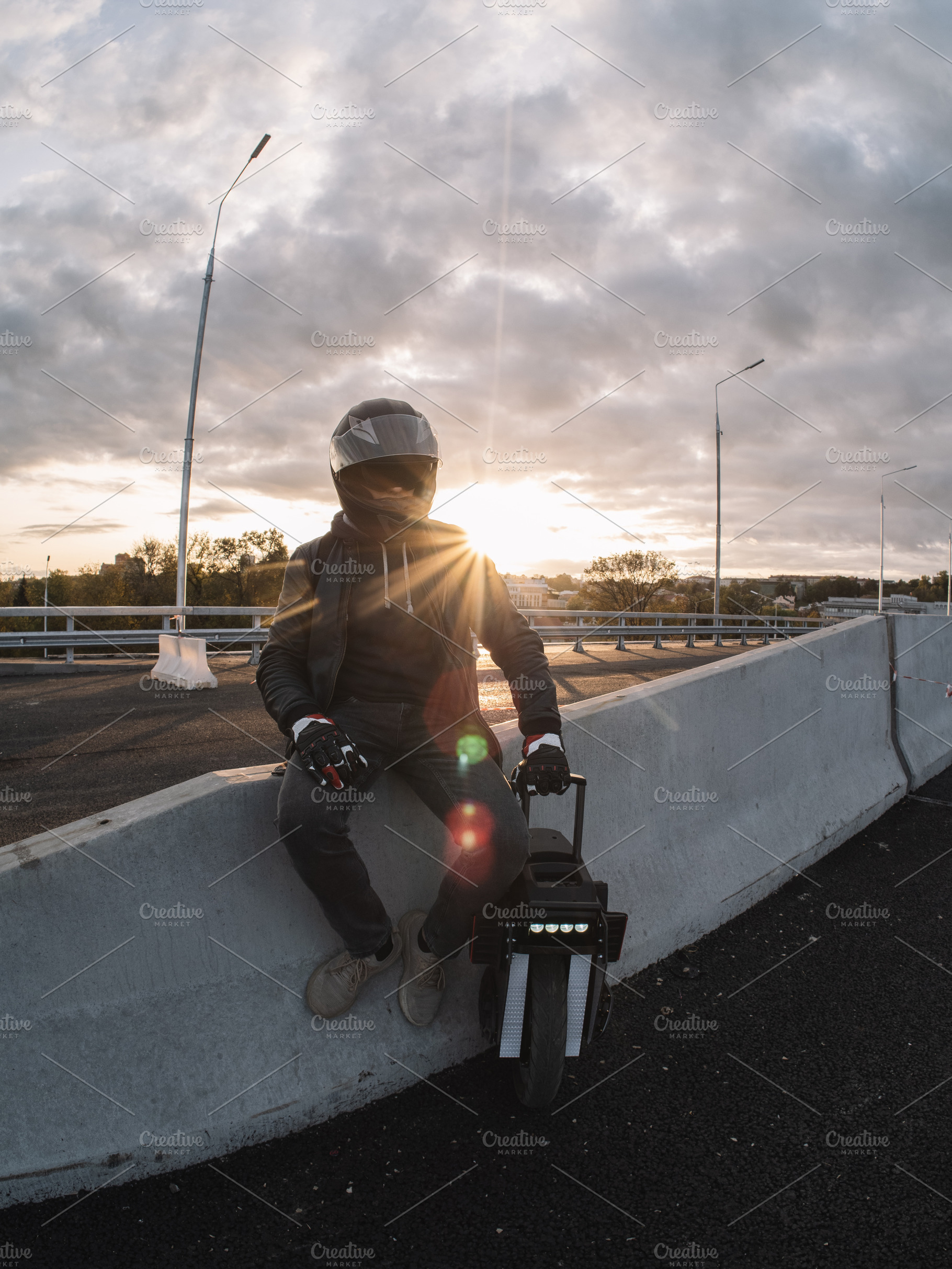 A male rider in protective gear riding an electric wheel. Urban, a Person Photo by PavelKant