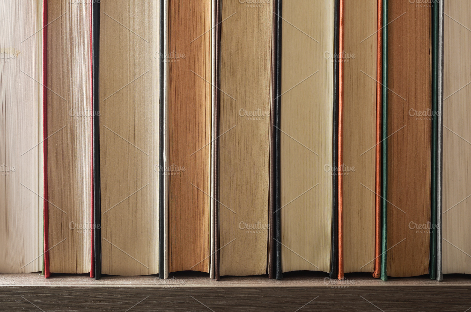 Detail of a row of books showing the front edge, a School & Education Photo by Davizro's Market