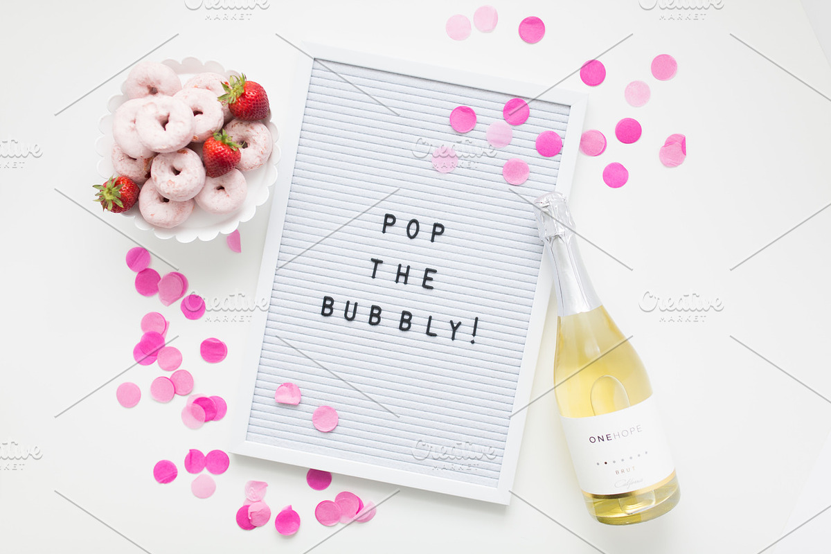 Confetti letter board + champagne containing one hope, pop the bubbly, and, a Business Photo by Morgan Anderson (Photo 2 of 2)