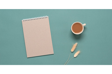 Brown craft notepad, cup of coffee