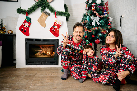 Family wearing matching Christmas pajamas, a Holiday Photo by YossSabalet