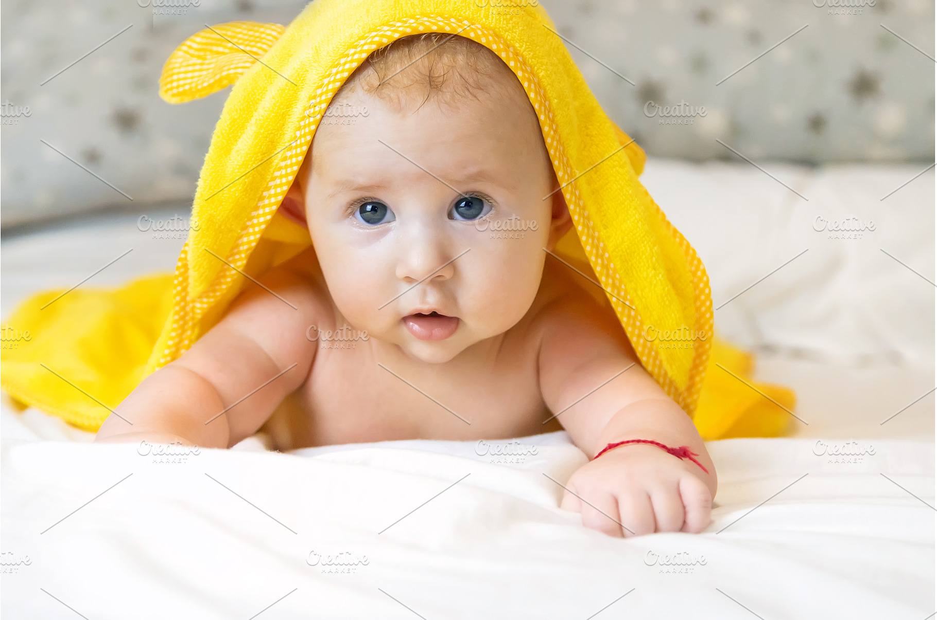 Little baby in a towel after bathing, a Person Photo by yanadjana