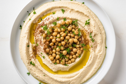 Classic hummus with herbs, olive oil in a vintage ceramic bowl flat lay, a Food & Drink Photo by Natalia Klenova's Shop