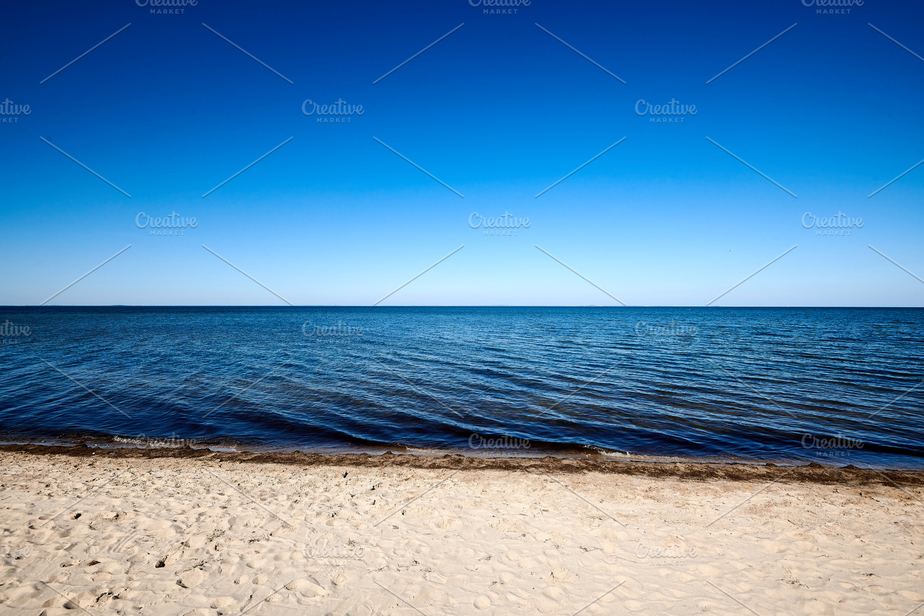 lonely beach with blue sky without clouds, a Nature Photo by Fotowunsch - photography 