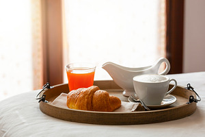 Delicious breakfast with croissant, cappuccino, orange juice and milk jug serve, a Food & Drink Photo by Antonio Gravante Market