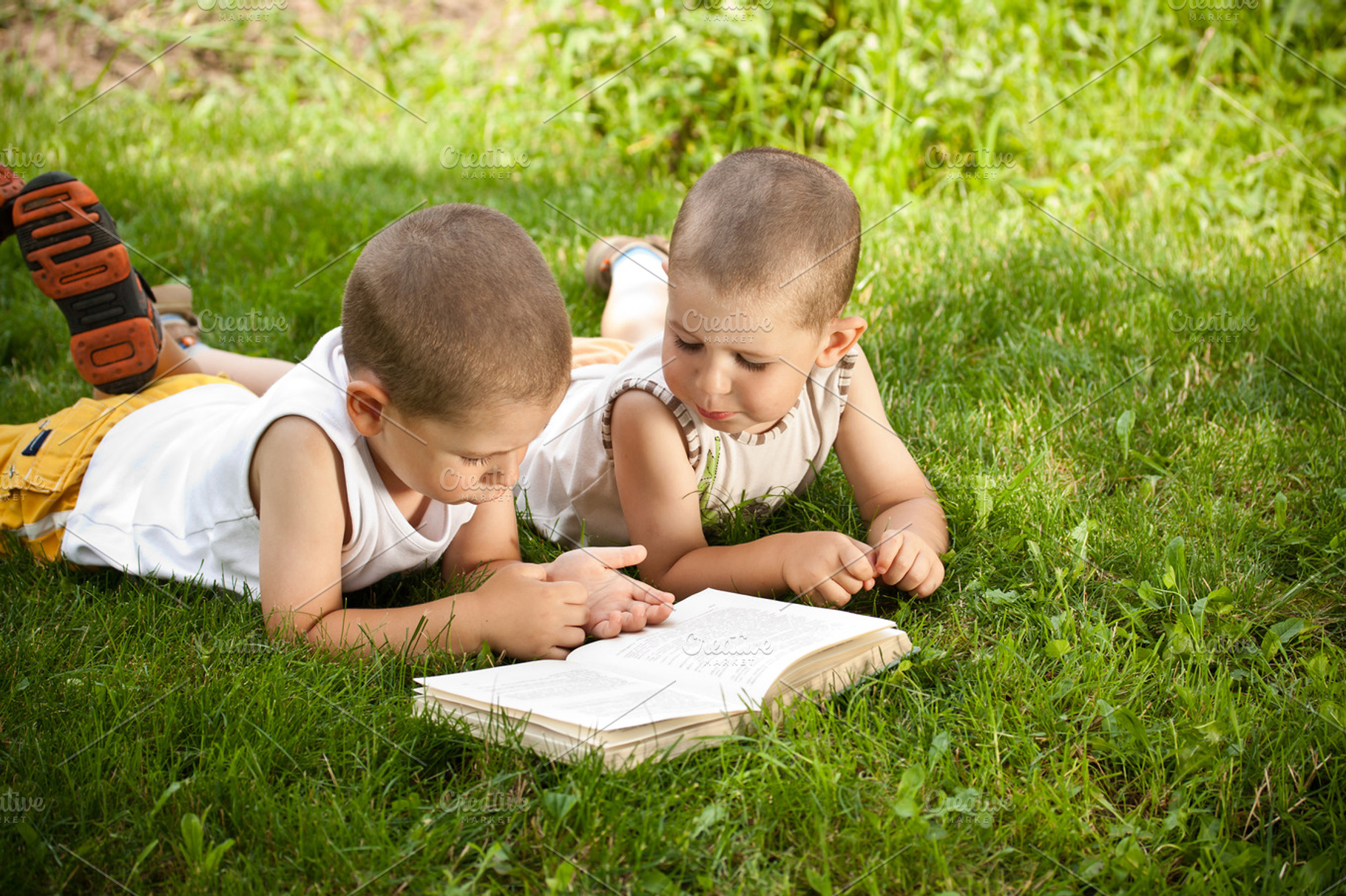 Boys reads a book featuring beautiful, beauty, and book