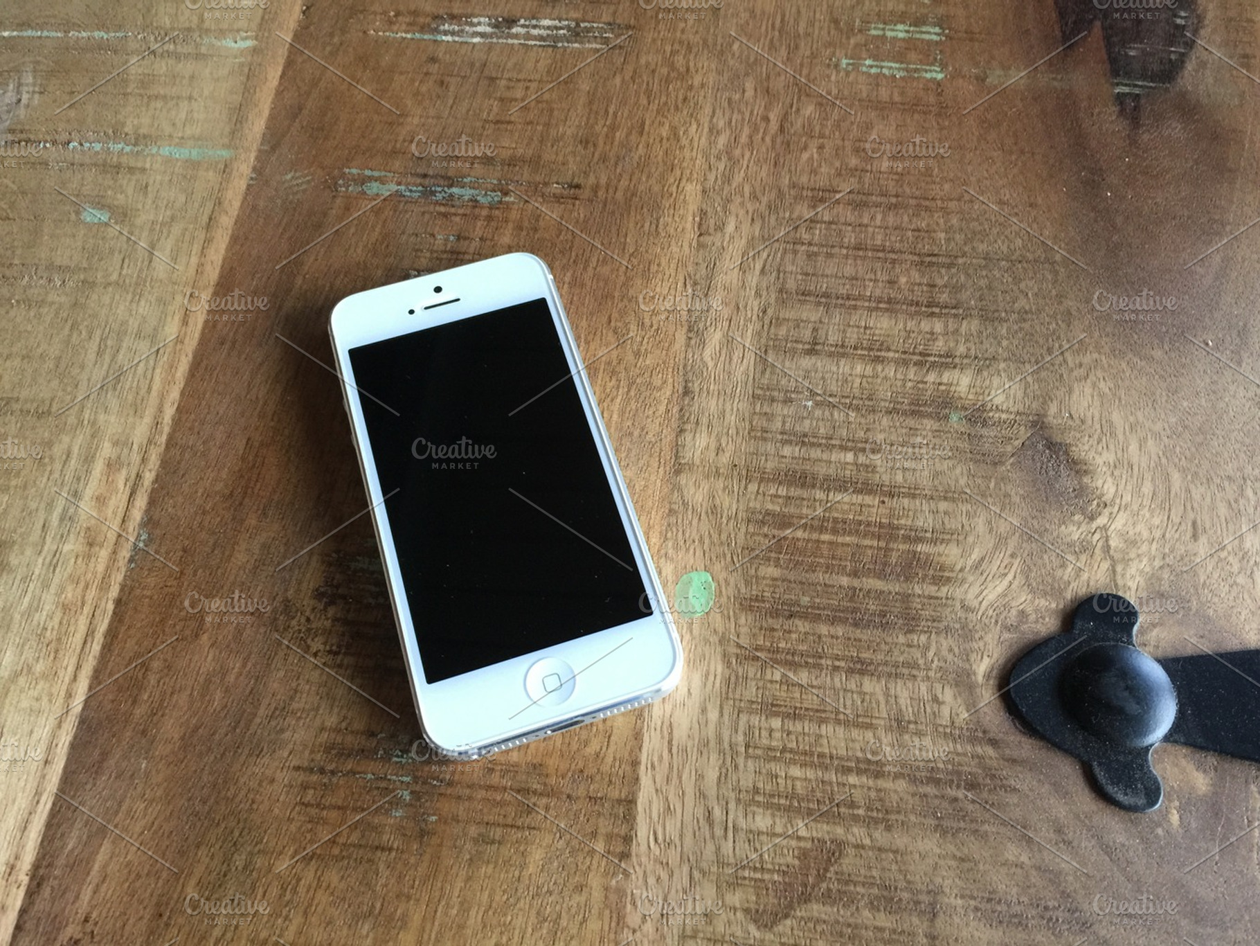 iPhone 5 on wood table, a Technology Photo by Amazing Photography