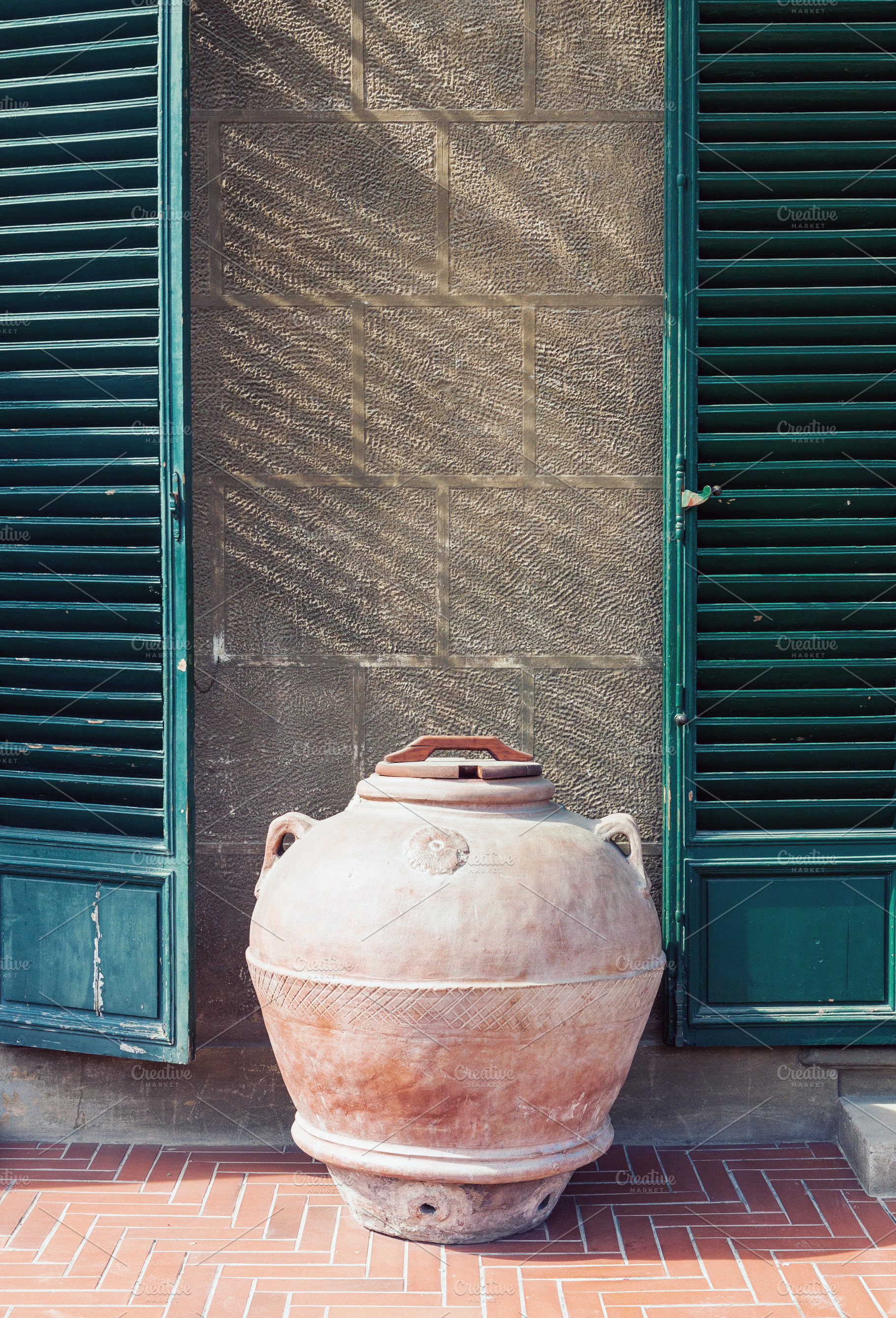 Antique roman clay jar by the wall, an Architecture Photo by BOOCYS