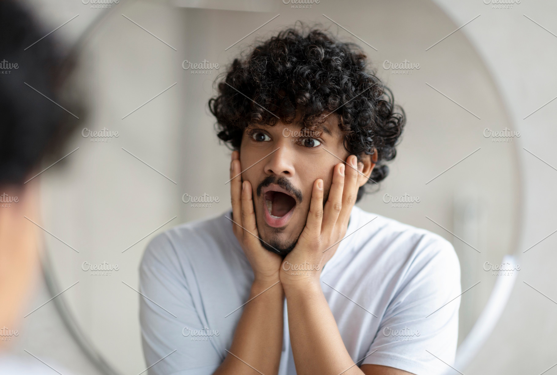 Skin problems concept. Shocked indian man looking at mirror and touching face,, a Person Photo by Prostock-Studio