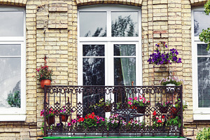 Balcony with flowers at summertime, an Architecture Photo by BOOCYS