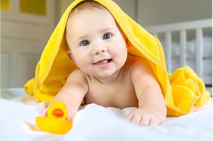 Baby after bathing in a towel, a Person Photo by yanadjana