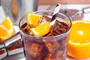 Cold summer cocktail with cola and oranges, a Food & Drink Photo by Rimma