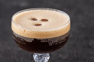 Classic Espresso Martini with thick crema foam and coffee bean g