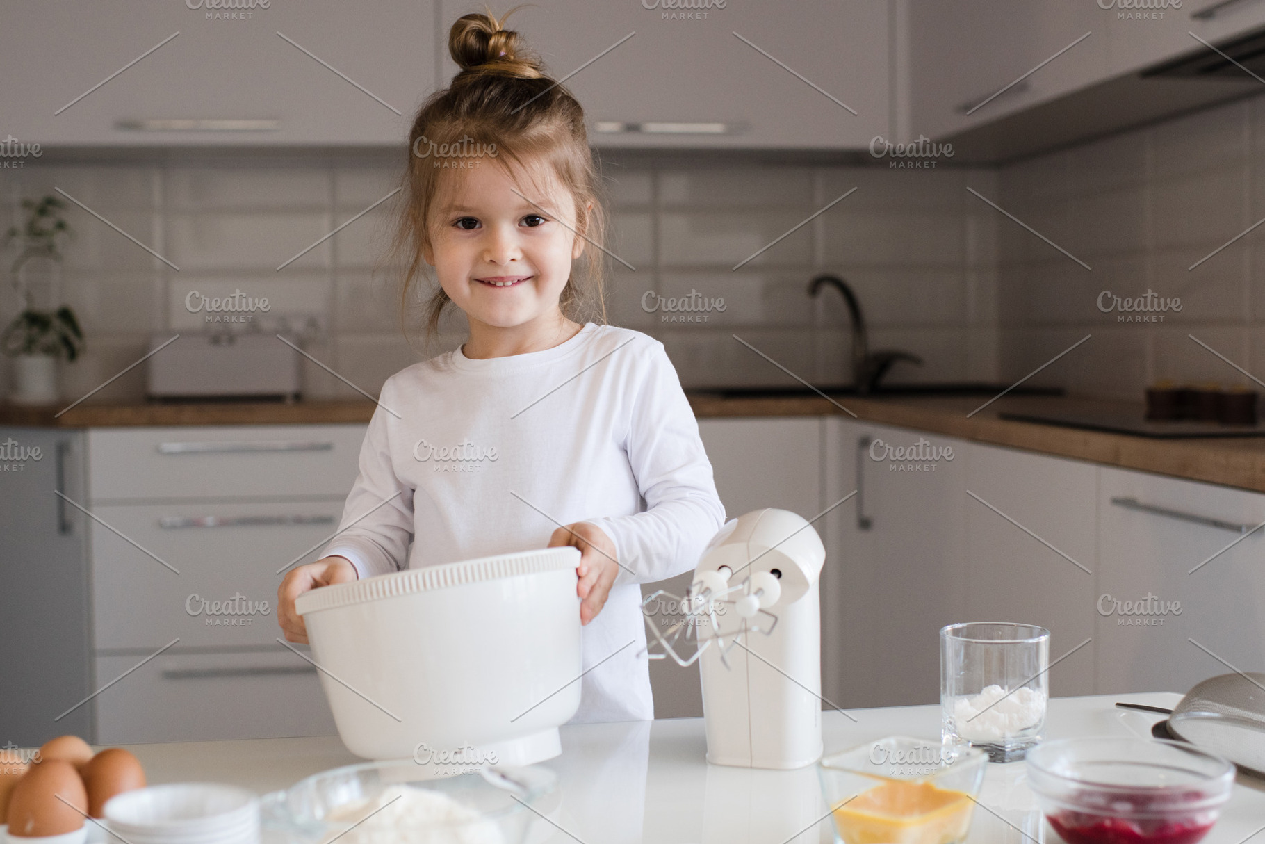 Child girl making cake, a Person Photo by morrowlight