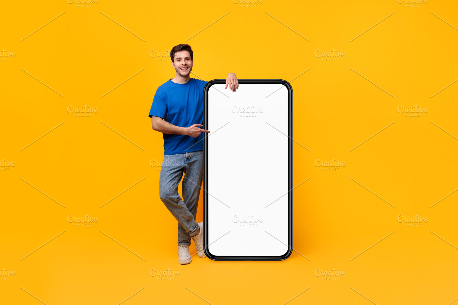 Guy pointing and leaning on big white empty smartphone screen, a Photo by Prostock-Studio