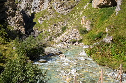 Mountain river and wood bridge in Vanoise national Park valley,, a Nature Photo by GoodGoods