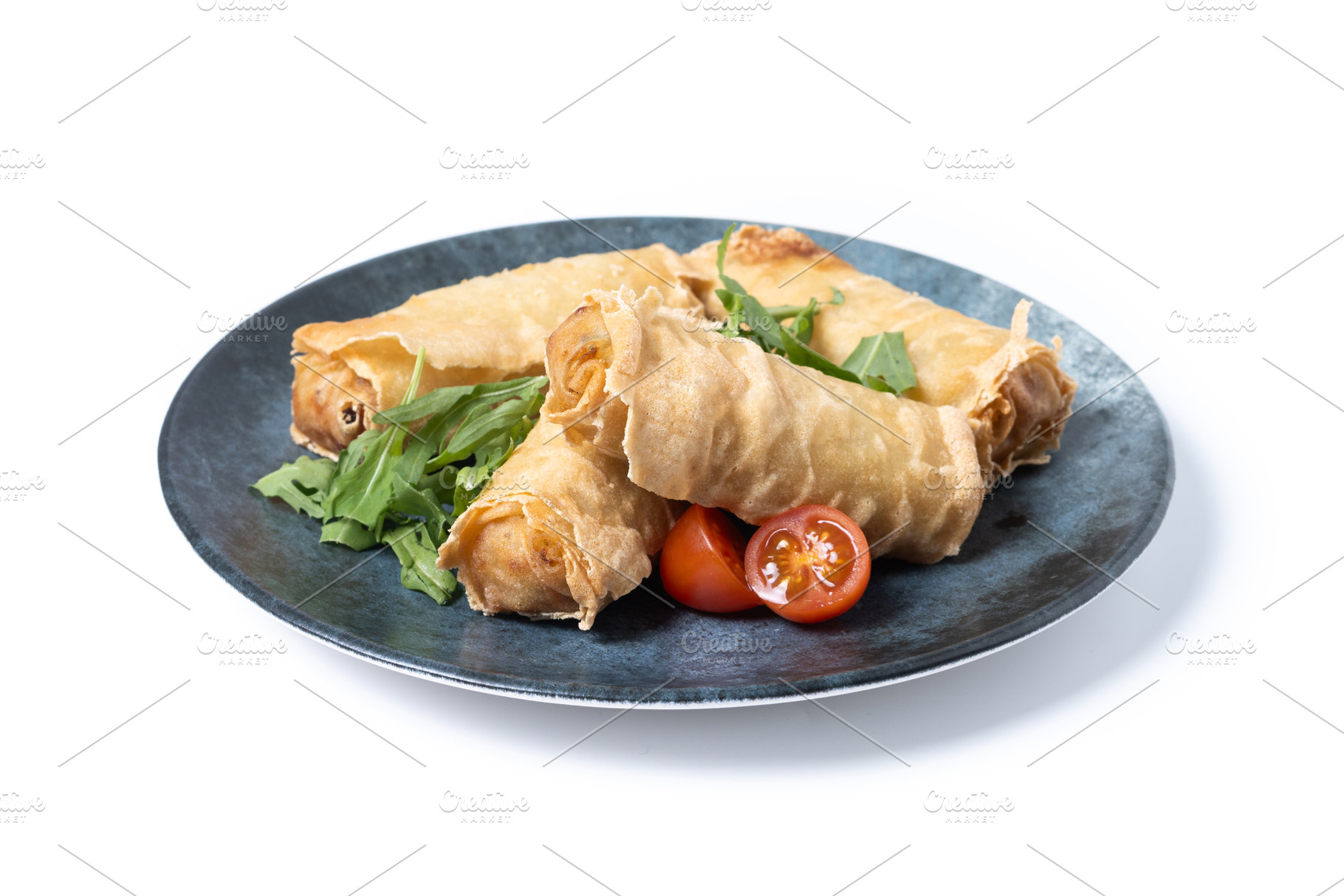 Crispy Spring Rolls on Ceramic Plate isolated on white background, a Food & Drink Photo by etorres69