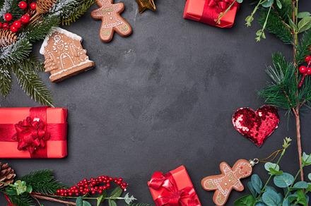 Christmas decor, gift red boxes on a black background, top view., a Holiday Photo by ndanko