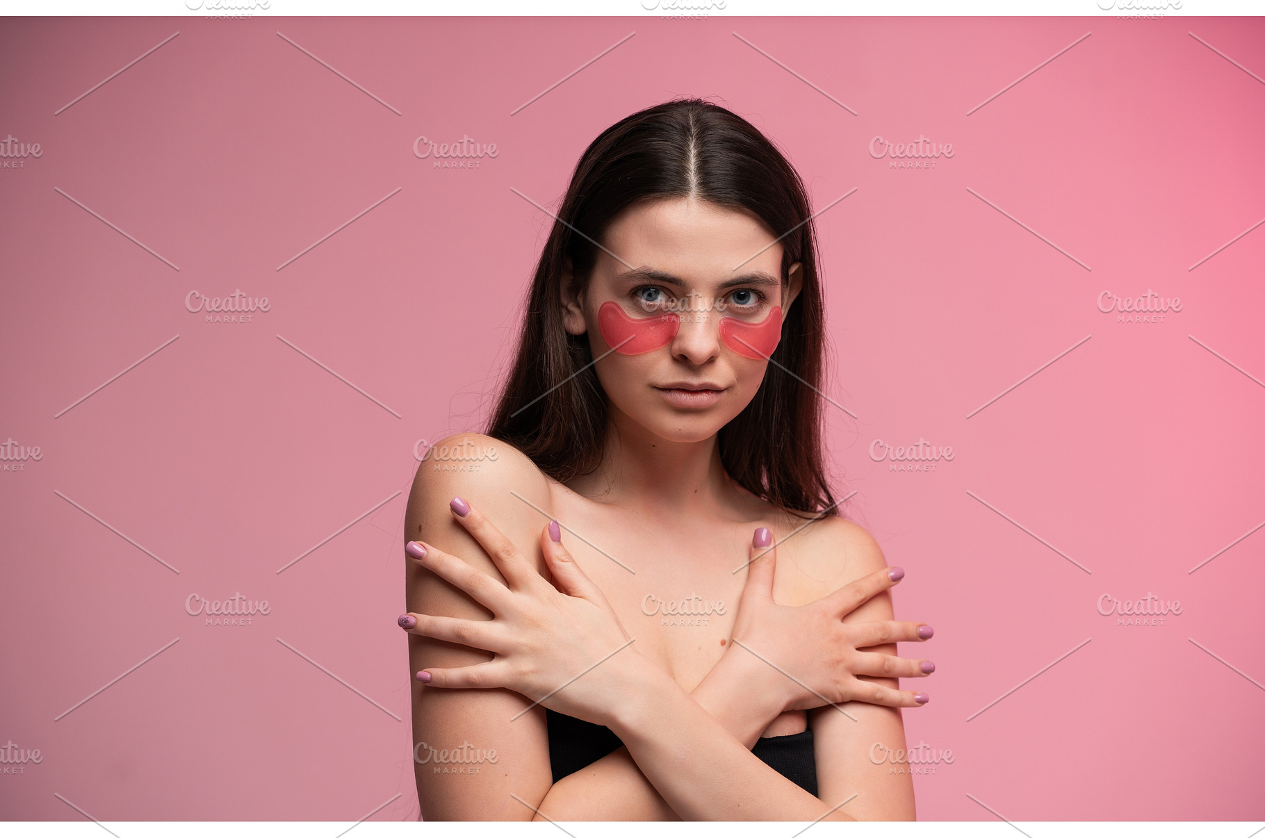 Woman posing with hydrating pink eye, a Health & Medical Photo by volodymyrshtun13795