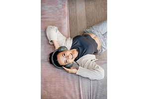 Woman relaxing at home, enjoying, a Person Photo by HalfPoint