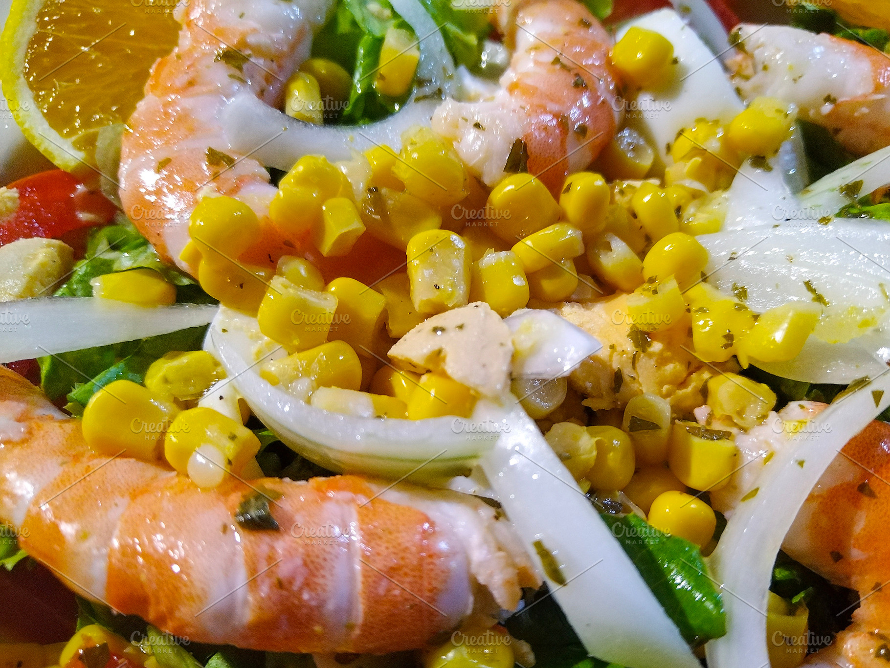 Colorful shrimp salad with corn and orange slices, a Food & Drink Photo by DanFLCreativo