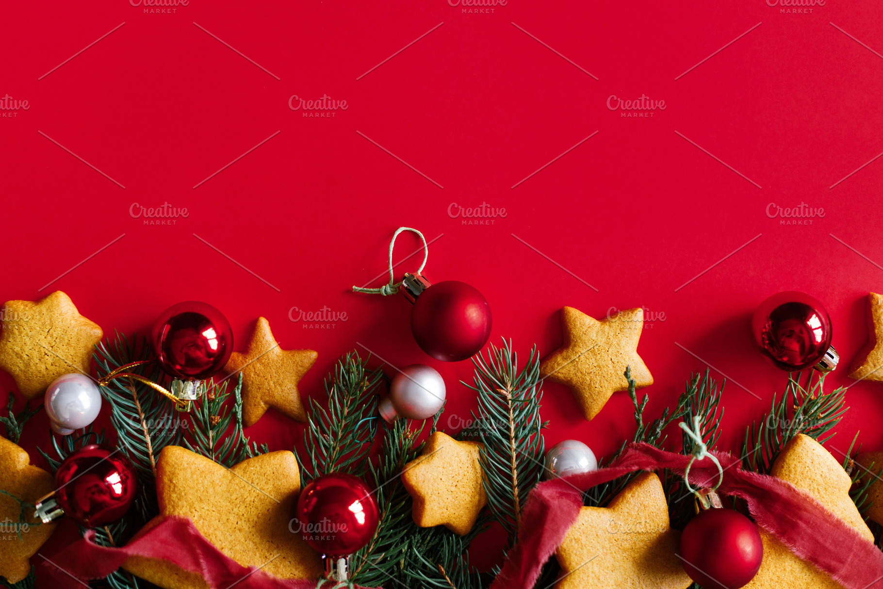 Festive holiday flatlay with Christmas gingerbread cookies, red, a Photo by Sonjachni