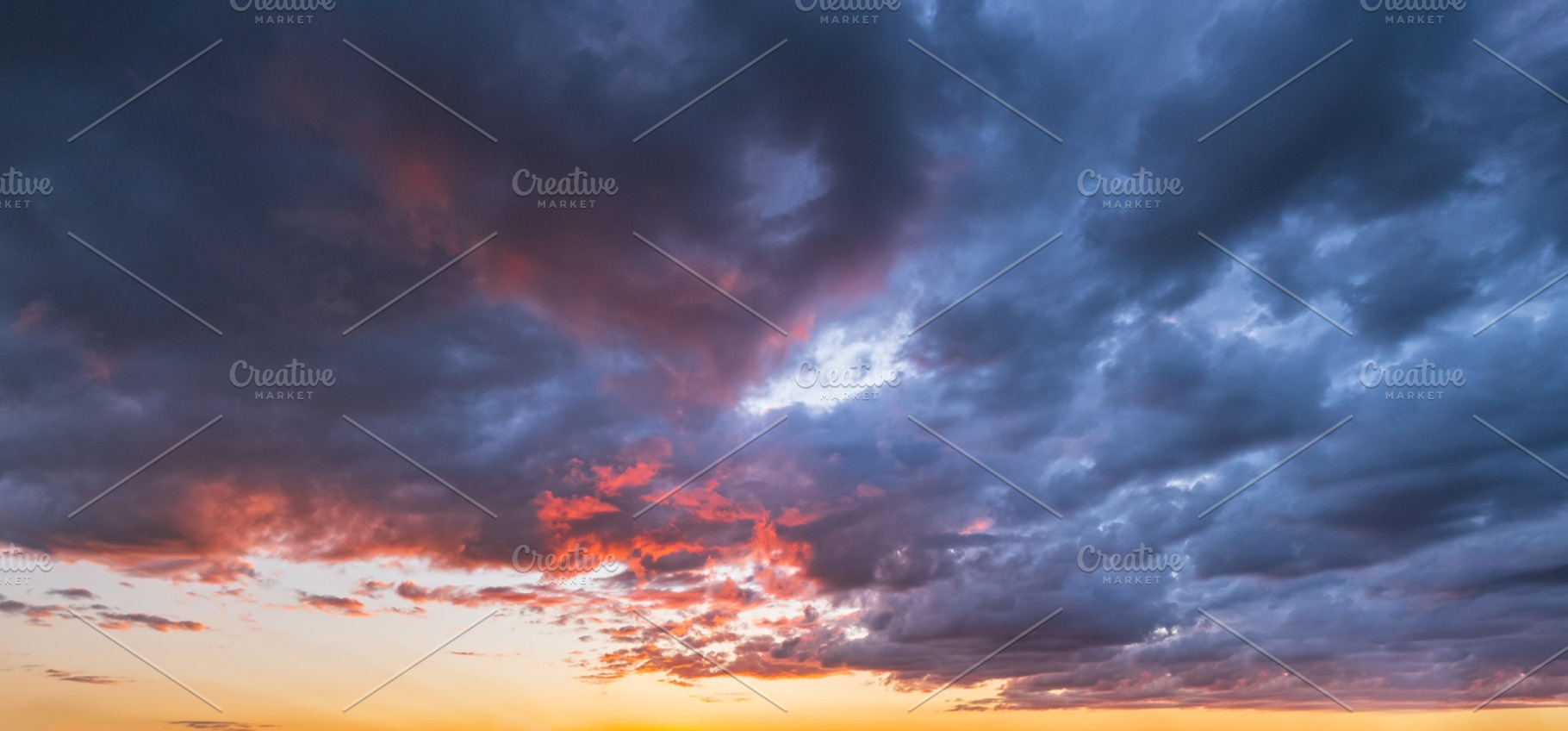 Clouds in evening dusk sky panoramic view. Climate, environment, a Nature Photo by YuriyB