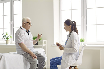 Elderly man talks about his health, a Health & Medical Photo by StudioRomantic