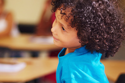 Playing with his homework, a Photo by Peopleimages.com