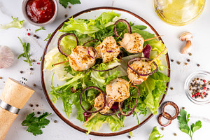Chicken kebab skewers with fresh vegetable salad, a Food & Drink Photo by Rimma