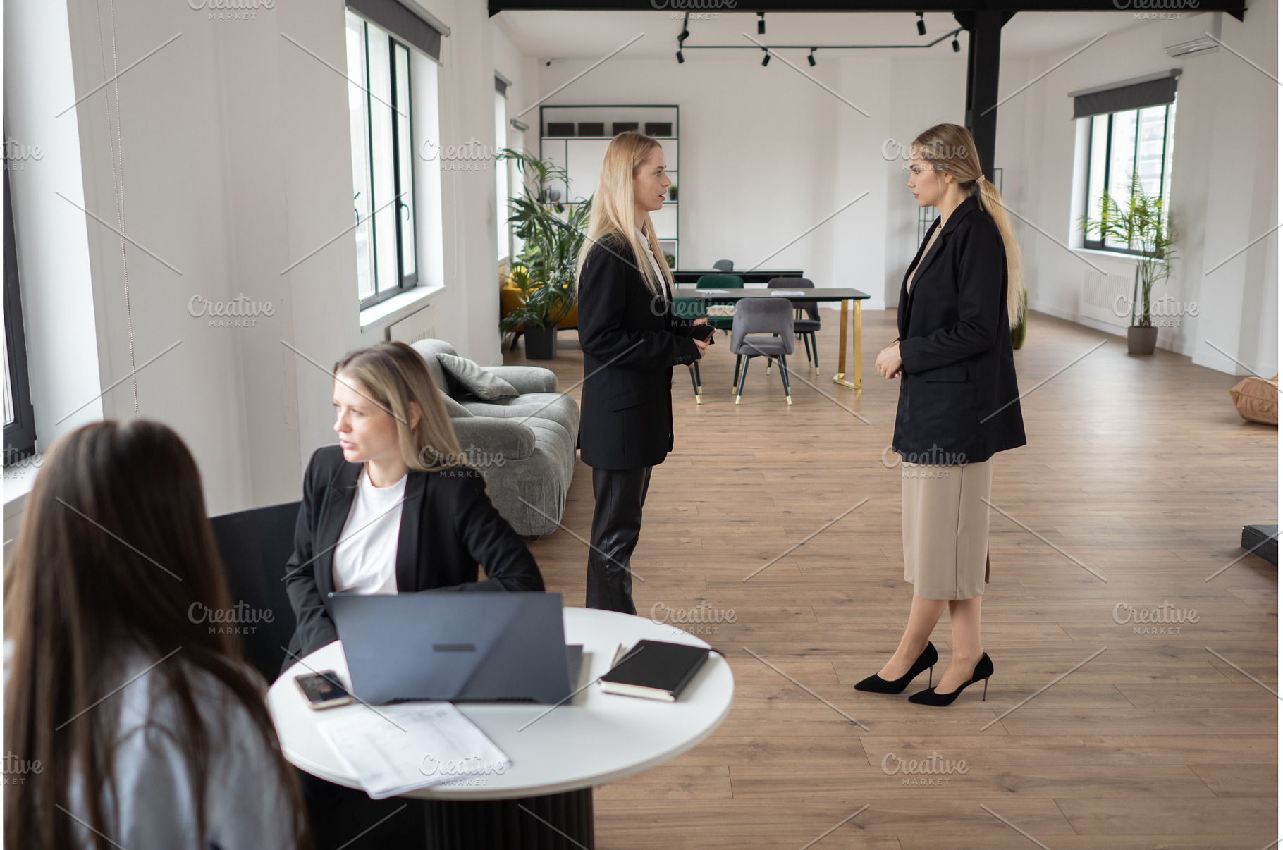 Two businesswomen collaborate over, a Technology Photo by undrey