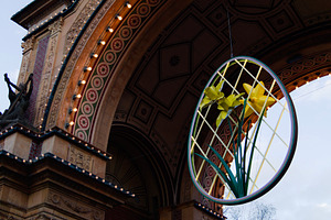 Ornate architectural arch with illuminated decor and daffodil design in Denmark, a Photo by AS photostudio
