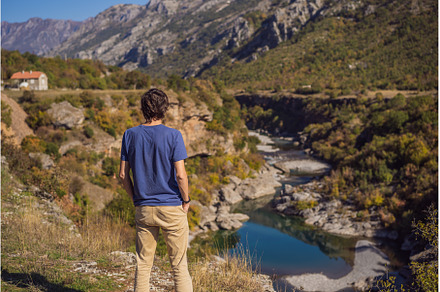 Montenegro. man tourist on the, an Architecture Photo by Elizaveta Galitskaya