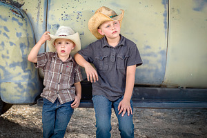 Two Young Boys Wearing Cowboy Hats, a Holiday Photo by Andy Dean Photography