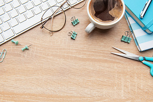 Overhead view of a modern desk with business essentials