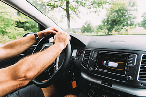 Close up of man driving car