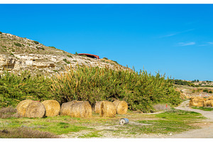 Haystacks at the foot of the Kourion Mount - Cyprus, a Nature Photo by Leonid Andronov