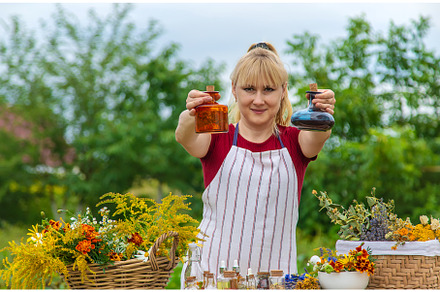 Woman with medicinal herbs and, a Nature Photo by yanadjana