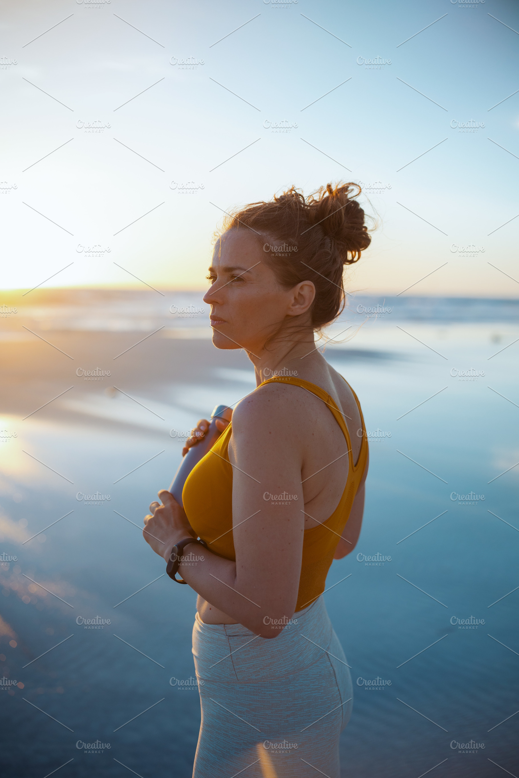 healthy sports woman in fitness clothes with bottle of water, a Person Photo by Alliance Images