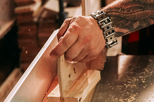 Woodworking process jointer planer carpenter hand, a Person Photo by Photo Drive Studio
